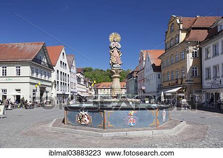 Stock Image - "Madonna with a crescent moon on the Marienbrunnen fountain on Marktplatz square, Schwabisch Gmund, Baden-Wurttemberg, Germany, Europe". Fotosearch
