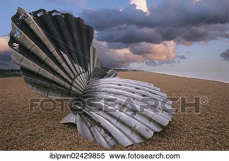 "Maggie Hambling shell sculpture to those who drowned at sea, Aldeburgh, Suffolk, England, United Kingdom, Europe" View Large Photo Image Stock Photography - "Maggie Hambling shell sculpture to those who drowned at sea, Aldeburgh, Suffolk, England, United Kingdom, Europe". Fotosearch