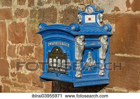 Stock Image - "Mailbox, replica from 1896 on a sandstone wall, old town, Budingen, Hesse, Germany, Europe". Fotosearch