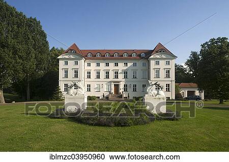 Stock Image - "Main facade and grounds of Schloss Wedendorf Castle, built in 1679, rebuilt in the neo-classical style in 1810, now a hotel, Wedendorf, Mecklenburg-Western Pomerania, Germany, Europe". Fotosearch
