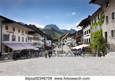 Stock Photo - "Main street in the medieval village of Gruyeres, Fribourg, Switzerland, Europe". Fotosearch