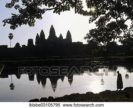 "Main temple of Angkor Wat reflected in a pond with a monk standing at the shore, silhouette at sunrise, UNESCO World Cultural Heritage Site, Siem Reap, Siem Reap Province, Cambodia, Asia" View Large Photo Image Stock Photography - "Main temple of Angkor Wat reflected in a pond with a monk standing at the shore, silhouette at sunrise, UNESCO World Cultural Heritage Site, Siem Reap, Siem Reap Province, Cambodia, Asia". Fotosearch