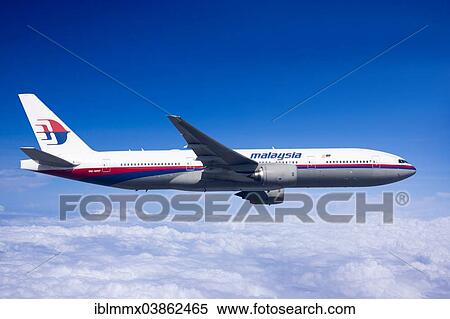 Stock Photography - Malaysia Airlines Boeing 777-2H6ER in flight. Fotosearch