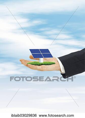 Male hand holding solar cell View Large Photo Image Stock Photograph - Male hand holding solar cell. Fotosearch