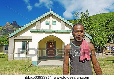 "Man, 27 years, standing in front of the Methodist church, village of Nalauwaki, Waya Island, Yasawa Islands, Fiji Islands, Fiji, Oceania" View Large Photo Image Picture - "Man, 27 years, standing in front of the Methodist church, village of Nalauwaki, Waya Island, Yasawa Islands, Fiji Islands, Fiji, Oceania". Fotosearch