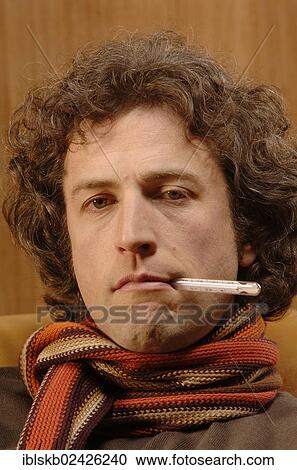 "Man, 30-40 years, with a fever thermometer in his mouth and a scarf around his neck" View Large Photo Image Stock Image - "Man, 30-40 years, with a fever thermometer in his mouth and a scarf around his neck". Fotosearch