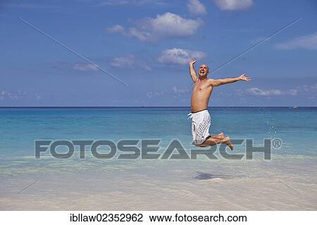 "Man, 45, jumping for joy at the beach of Anse Intendance, Mahe, Seychelles, Africa, Indian Ocean, Africa" View Large Photo Image Stock Image - "Man, 45, jumping for joy at the beach of Anse Intendance, Mahe, Seychelles, Africa, Indian Ocean, Africa". Fotosearch