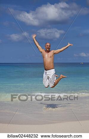 "Man, 45 years, jumping for joy on the beach of Anse Intendance, Mahe, Seychelles, Africa, Indian Ocean, Africa" View Large Photo Image Stock Image - "Man, 45 years, jumping for joy on the beach of Anse Intendance, Mahe, Seychelles, Africa, Indian Ocean, Africa". Fotosearch