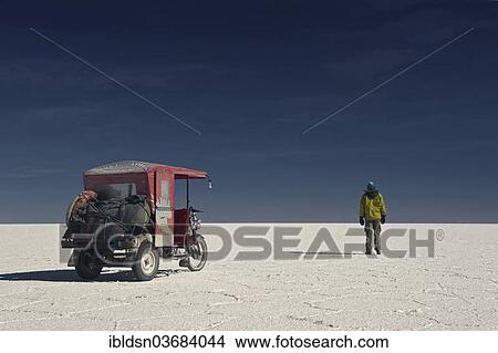"Man and a mototaxi on the dry salt lake of Salar de Uyuni, Uyuni, Bolivia, South America" View Large Photo Image Picture - "Man and a mototaxi on the dry salt lake of Salar de Uyuni, Uyuni, Bolivia, South America". Fotosearch