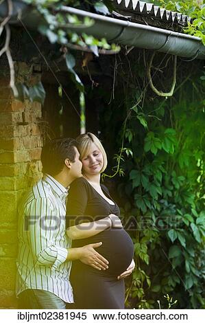 Man and a pregnant woman holding their hands on her belly View Large Photo Image Stock Photography - Man and a pregnant woman holding their hands on her belly. Fotosearch