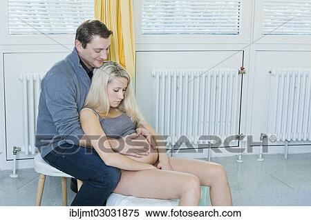 "Man and woman in the delivery room during childbirth, the woman is sitting on a birth stool during labour, Germany, Europe" View Large Photo Image Stock Photography - "Man and woman in the delivery room during childbirth, the woman is sitting on a birth stool during labour, Germany, Europe". Fotosearch