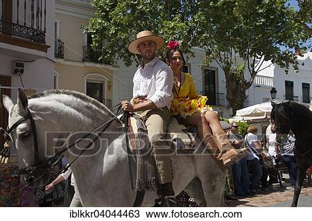"Man and woman on a horse, Romario de San Isidore pilgrimage in Nerja, Costa del Sol, Andalucia, Spain, Europe" View Large Photo Image Stock Image - "Man and woman on a horse, Romario de San Isidore pilgrimage in Nerja, Costa del Sol, Andalucia, Spain, Europe". Fotosearch
