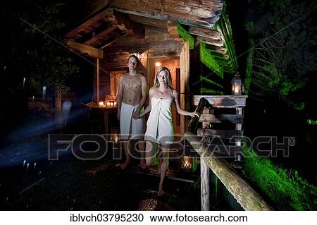 Man and woman standing in front of a Finnish wood-fired sauna View Large Photo Image Stock Image - Man and woman standing in front of a Finnish wood-fired sauna. Fotosearch