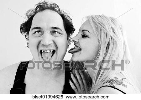 Man and woman sticking out their tongues View Large Photo Image Stock Photography - Man and woman sticking out their tongues. Fotosearch