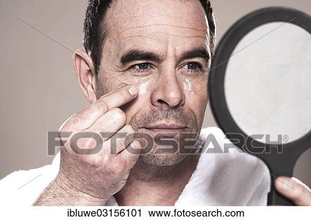 "Man applying eye pads, facial care, Mannheim, Baden-Wurttemberg, Germany, Europe" View Large Photo Image Stock Image - "Man applying eye pads, facial care, Mannheim, Baden-Wurttemberg, Germany, Europe". Fotosearch