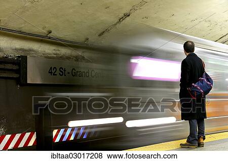 "Man at the platform, Number 7 Subway, Grand Central Terminal, 42nd Street, Manhattan, New York City, New York, United States, North America" View Large Photo Image Stock Photo - "Man at the platform, Number 7 Subway, Grand Central Terminal, 42nd Street, Manhattan, New York City, New York, United States, North America". Fotosearch