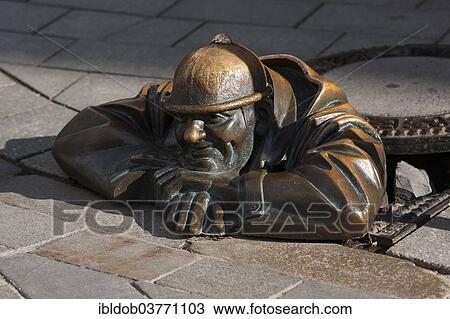 "Man at work"""", sculpture in a manhole cover, by Viktor Hulik, Bratislava, Slovakia, Europe" View Large Photo Image Stock Image - "Man at work"""", sculpture in a manhole cover, by Viktor Hulik, Bratislava, Slovakia, Europe". Fotosearch