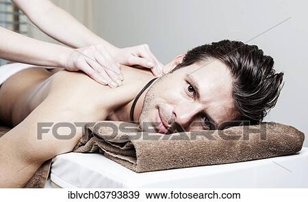 Man being massaged View Large Photo Image Stock Photo - Man being massaged. Fotosearch