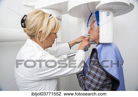 "Man being prepared for an X-ray of his teeth, wearing a lead vest for protection from radiation, Germany, Europe" View Large Photo Image Stock Image - "Man being prepared for an X-ray of his teeth, wearing a lead vest for protection from radiation, Germany, Europe". Fotosearch