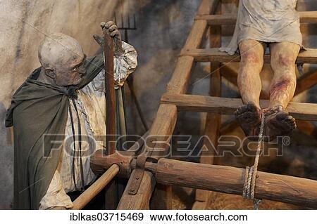 "Man being tortured on a rack, lifelike characters, torture chamber of Loket Castle, Loket, Karlovy Vary Region, Bohemia, Czech Republic, Europe" View Large Photo Image Stock Photo - "Man being tortured on a rack, lifelike characters, torture chamber of Loket Castle, Loket, Karlovy Vary Region, Bohemia, Czech Republic, Europe". Fotosearch