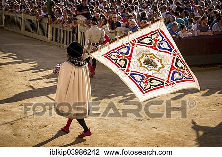 "Man carrying a flag from the Crested Porcupine or Istrice contrade, historical parade before the Palio di Siena horse race, Siena, Tuscany, Italy, Europe" View Large Photo Image Stock Image - "Man carrying a flag from the Crested Porcupine or Istrice contrade, historical parade before the Palio di Siena horse race, Siena, Tuscany, Italy, Europe". Fotosearch