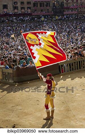 "Man carrying a flag from the Ram contrade, historical parade before the Palio di Siena horse race, Siena, Tuscany, Italy, Europe" View Large Photo Image Stock Image - "Man carrying a flag from the Ram contrade, historical parade before the Palio di Siena horse race, Siena, Tuscany, Italy, Europe". Fotosearch