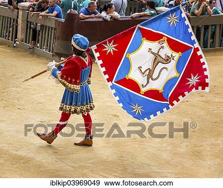 Stock Photo - "Man carrying a flag from the Pantheress contrade, historical parade before the Palio di Siena horse race, Siena, Tuscany, Italy, Europe". Fotosearch