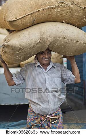 "Man carrying two bags filled with spices on his head, Jew Town, Mattancherry, Kochi, Kerala, India, Asia" View Large Photo Image Stock Photography - "Man carrying two bags filled with spices on his head, Jew Town, Mattancherry, Kochi, Kerala, India, Asia". Fotosearch
