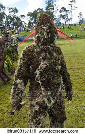 "Man covered in moss at the traditional sing-sing gathering, Hochland, Mount Hagen, Western Highlands Province, Papua New Guinea, Oceania" View Large Photo Image Stock Photo - "Man covered in moss at the traditional sing-sing gathering, Hochland, Mount Hagen, Western Highlands Province, Papua New Guinea, Oceania". Fotosearch