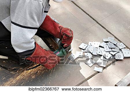 Man cutting metal with an angle grinder View Large Photo Image Stock Photo - Man cutting metal with an angle grinder. Fotosearch