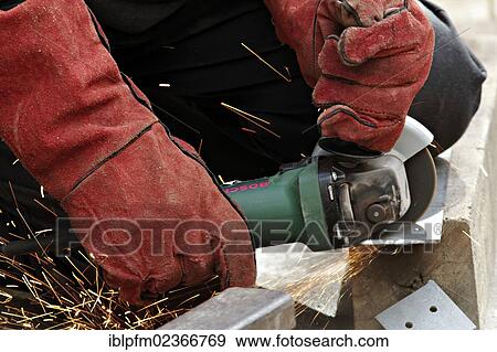 Man cutting metal with an angle grinder View Large Photo Image Stock Photo - Man cutting metal with an angle grinder. Fotosearch
