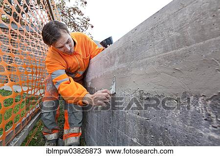 "Man doing concrete restoration and construction work on the main building of the HSG University of St. Gallen, Switzerland, Europe" View Large Photo Image Stock Image - "Man doing concrete restoration and construction work on the main building of the HSG University of St. Gallen, Switzerland, Europe". Fotosearch