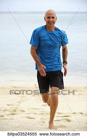 "Man, early 40's, jogging along a sand beach, Le Morne, La Gaulette, Mauritius, Africa" View Large Photo Image Stock Photography - "Man, early 40's, jogging along a sand beach, Le Morne, La Gaulette, Mauritius, Africa". Fotosearch