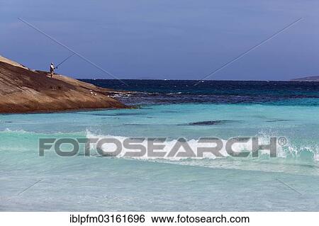 Stock Photograph - "Man fishing from the rocks, Esperance, Western Australia, Australia, Oceania". Fotosearch