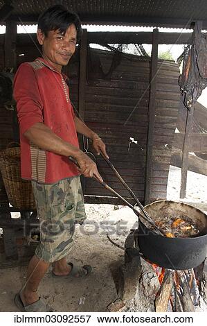"Man frying slaughtered and dissected dogs in hot oil, Siem Reap, Siem Reap, Siem Reap Province, Cambodia, Asia" View Large Photo Image Stock Photo - "Man frying slaughtered and dissected dogs in hot oil, Siem Reap, Siem Reap, Siem Reap Province, Cambodia, Asia". Fotosearch