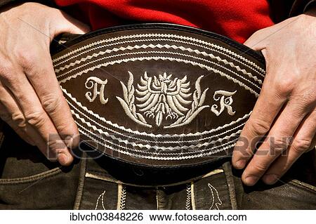 "Man holding his traditional belt with both hands, Gauderfest festival with traditional costumes, Zell am Ziller, Zillertal, North Tyrol, Austria, Europe" View Large Photo Image Stock Photograph - "Man holding his traditional belt with both hands, Gauderfest festival with traditional costumes, Zell am Ziller, Zillertal, North Tyrol, Austria, Europe". Fotosearch