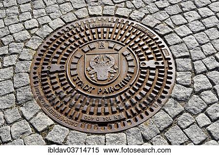 "Man-hole cover with inscription, """"Stadt Parchim"""", Parchim, Mecklenburg-Western Pomerania, Germany, Europe" View Large Photo Image Stock Photography - "Man-hole cover with inscription, """"Stadt Parchim"""", Parchim, Mecklenburg-Western Pomerania, Germany, Europe". Fotosearch