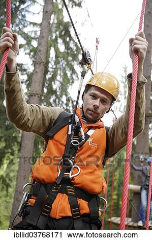 "Man in a climbing park, Karlovy Vary Region, Bohemia, Czech Republic, Europe" View Large Photo Image Stock Image - "Man in a climbing park, Karlovy Vary Region, Bohemia, Czech Republic, Europe". Fotosearch