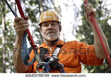 "Man in a climbing park, Karlovy Vary Region, Bohemia, Czech Republic, Europe" View Large Photo Image Stock Photo - "Man in a climbing park, Karlovy Vary Region, Bohemia, Czech Republic, Europe". Fotosearch