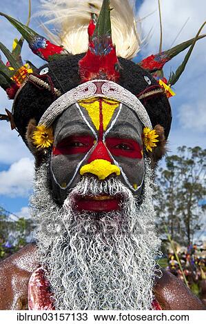 "Man in a colourfully decorated costume with face paint at the traditional sing-sing gathering, Hochland, Mount Hagen, Western Highlands Province, Papua New Guinea, Oceania" View Large Photo Image Stock Image - "Man in a colourfully decorated costume with face paint at the traditional sing-sing gathering, Hochland, Mount Hagen, Western Highlands Province, Papua New Guinea, Oceania". Fotosearch