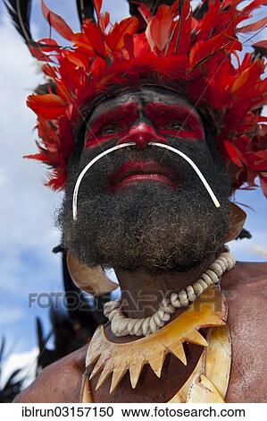 "Man in a colourfully decorated costume with face paint at the traditional sing-sing gathering, Hochland, Mount Hagen, Western Highlands Province, Papua New Guinea, Oceania" View Large Photo Image Stock Image - "Man in a colourfully decorated costume with face paint at the traditional sing-sing gathering, Hochland, Mount Hagen, Western Highlands Province, Papua New Guinea, Oceania". Fotosearch