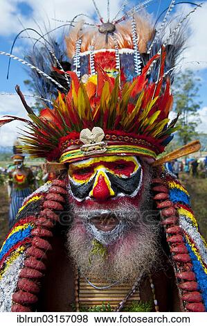 "Man in a colourfully decorated costume with face paint at the traditional sing-sing gathering, Hochland, Mount Hagen, Western Highlands Province, Papua New Guinea, Oceania" View Large Photo Image Stock Photo - "Man in a colourfully decorated costume with face paint at the traditional sing-sing gathering, Hochland, Mount Hagen, Western Highlands Province, Papua New Guinea, Oceania". Fotosearch