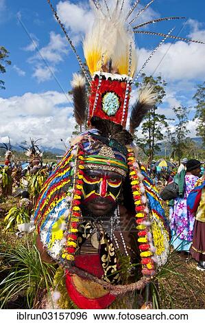 "Man in a colourfully decorated costume with face paint at the traditional sing-sing gathering, Hochland, Mount Hagen, Western Highlands Province, Papua New Guinea, Oceania" View Large Photo Image Stock Photograph - "Man in a colourfully decorated costume with face paint at the traditional sing-sing gathering, Hochland, Mount Hagen, Western Highlands Province, Papua New Guinea, Oceania". Fotosearch