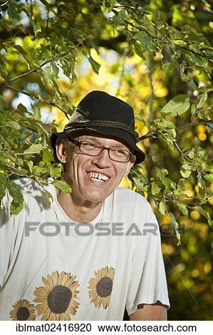 Stock Image - Man in the garden, portrait. Fotosearch