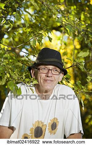 Man in the garden, portrait View Large Photo Image Stock Image - Man in the garden, portrait. Fotosearch
