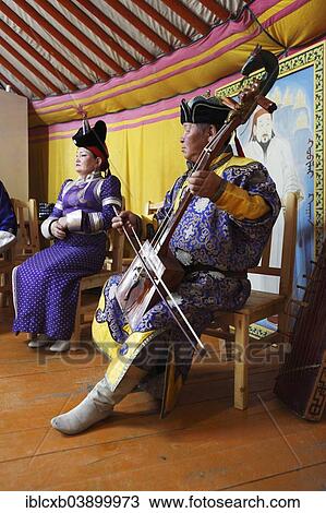 "Man in the traditional costume of the Khalkha Mongols playing the horse-head fiddle, Kharkhorin, Southern Steppe, Ovorkhangai Province, Mongolia, Asia" View Large Photo Image Stock Image - "Man in the traditional costume of the Khalkha Mongols playing the horse-head fiddle, Kharkhorin, Southern Steppe, Ovorkhangai Province, Mongolia, Asia". Fotosearch