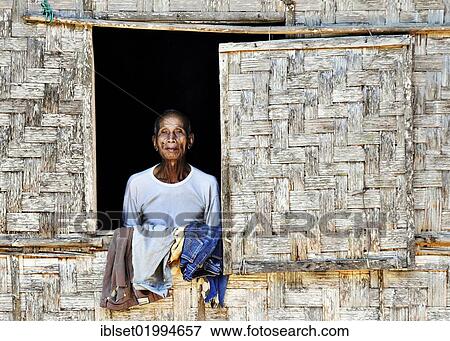 "Man in the window of a bamboo hut, Laos, Southeast Asia, Asia" View Large Photo Image Stock Photo - "Man in the window of a bamboo hut, Laos, Southeast Asia, Asia". Fotosearch