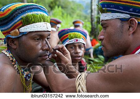 "Man is made up for the traditional Sing Sing gathering in the highlands, Paya, Papua New Guinea, Oceania" View Large Photo Image Stock Image - "Man is made up for the traditional Sing Sing gathering in the highlands, Paya, Papua New Guinea, Oceania". Fotosearch