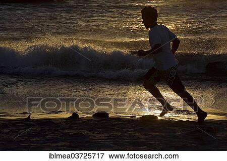 "Man jogging along a beach, silhouette at sunset, Jericoacoara, Ceara, Brazil, South America" View Large Photo Image Stock Photo - "Man jogging along a beach, silhouette at sunset, Jericoacoara, Ceara, Brazil, South America". Fotosearch