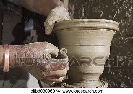 "Man making pottery by hand with simple equipment, Kathmandu Valley, Thimi, Kathmandu District, Bagmati Zone, Nepal, Asia" View Large Photo Image Picture - "Man making pottery by hand with simple equipment, Kathmandu Valley, Thimi, Kathmandu District, Bagmati Zone, Nepal, Asia". Fotosearch